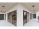 Hallway in condo building with neutral paint, recessed lights and doors to individual units at 438 Mariner Dr, Tarpon Springs, FL 34689