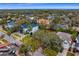 An aerial view shows the land parcel is located in a neighborhood with mature trees and sidewalks at 4610 W Lamb Ave, Tampa, FL 33629