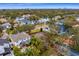 Aerial view of cleared land in established neighborhood; close to mature trees, homes and easy access at 4610 W Lamb Ave, Tampa, FL 33629