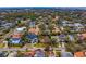 Aerial view of land parcel surrounded by lush green trees and residential homes in the neighborhood at 4610 W Lamb Ave, Tampa, FL 33629