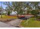 View of a vacant lot, highlighting the building potential in a residential area with a lush lawn at 4610 W Lamb Ave, Tampa, FL 33629