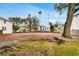 Residential lot showcasing the development potential in an established neighborhood with mature trees and nearby homes at 4610 W Lamb Ave, Tampa, FL 33629