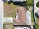 Aerial view of a single-story home showcasing the roof, yard, and surrounding neighborhood at 5117 School Rd, New Port Richey, FL 34653