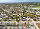 An aerial view of a neighborhood featuring a dense suburban landscape with mature trees at 5117 School Rd, New Port Richey, FL 34653