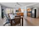 Bright dining area with a dining table, tile floors and windows with natural light at 5117 School Rd, New Port Richey, FL 34653