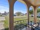 Covered front porch showing neighborhood views, complete with chairs and a table for relaxing at 5117 School Rd, New Port Richey, FL 34653