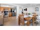 Kitchen and dining area with tile floors, stainless steel appliances, and dining table at 5117 School Rd, New Port Richey, FL 34653