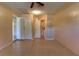 Spacious basement with ceiling fan and an open closet at 5155 Kenmore St, Spring Hill, FL 34608
