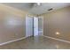 Bedroom with tiled floor, closet and a ceiling fan at 5155 Kenmore St, Spring Hill, FL 34608
