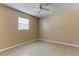 Bedroom with tiled floor, baseboard and a window at 5155 Kenmore St, Spring Hill, FL 34608
