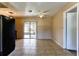 A brightly lit dining area with sliding glass doors with backyard view at 5155 Kenmore St, Spring Hill, FL 34608