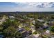 Aerial view of the house surrounded by trees, the home encircled by a white line at 5611 Venetian Ne Blvd, St Petersburg, FL 33703