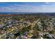 Aerial view of the house on a street, the home encircled by a white line, and a waterway in the background at 5611 Venetian Ne Blvd, St Petersburg, FL 33703