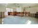 Open-concept living room undergoing renovation, showing framework and potential for customization at 5611 Venetian Ne Blvd, St Petersburg, FL 33703