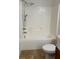 Bathroom featuring a shower and tub combination and granite countertops at 6011 Skydale Way # 101, Riverview, FL 33578