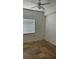 Bedroom featuring tile floors, a ceiling fan, and a window with blinds at 6011 Skydale Way # 101, Riverview, FL 33578