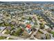 Aerial view of neighborhood with waterfront canals, a pool, and a fenced-in yard at 6333 Spanish Main Dr, Apollo Beach, FL 33572
