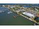 Panoramic aerial showcases waterfront restaurant with dock, marina, ample parking, and scenic views at 6333 Spanish Main Dr, Apollo Beach, FL 33572