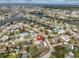 Aerial view of neighborhood with waterfront canals, a pool, and a fenced-in yard at 6333 Spanish Main Dr, Apollo Beach, FL 33572