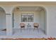 Cozy front porch with seating and a view of the neighborhood at 6333 Spanish Main Dr, Apollo Beach, FL 33572