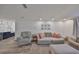 Comfortable living room featuring a plush sofa and recliner with wood flooring at 6333 Spanish Main Dr, Apollo Beach, FL 33572