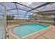 Refreshing pool with a screened enclosure, providing a private outdoor oasis with ample space at 6333 Spanish Main Dr, Apollo Beach, FL 33572