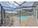 Spacious screened pool area featuring outdoor seating and views of the expansive backyard at 6333 Spanish Main Dr, Apollo Beach, FL 33572
