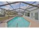 Inviting screened-in pool with crystal-clear water, perfect for relaxation and entertaining at 6333 Spanish Main Dr, Apollo Beach, FL 33572