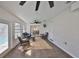 Enclosed sunroom boasting tile flooring, large windows, comfortable seating, and serene pool views at 6333 Spanish Main Dr, Apollo Beach, FL 33572