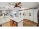 Bright kitchen features a breakfast bar, granite countertops, and stainless steel appliances at 716 Samantha Dr, Palm Harbor, FL 34683