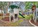 Backyard playground with slide and climbing structure at 716 Samantha Dr, Palm Harbor, FL 34683