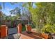 Charming back yard featuring a garden and beautiful greenery at 912 E 23Rd Ave, Tampa, FL 33605