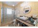 Modern bathroom with glass shower, modern fixtures, and tiled floor offers a spa-like experience at 912 E 23Rd Ave, Tampa, FL 33605