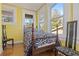 Bedroom featuring hardwood floors, good natural light, and traditional furnishings at 912 E 23Rd Ave, Tampa, FL 33605
