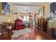 Bright bedroom with hardwood floors, seating area, and lots of natural light creates an inviting personal space at 912 E 23Rd Ave, Tampa, FL 33605