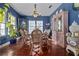 Comfortable dining room offering hardwood floors, artwork, and bright windows providing an atmosphere for dining at 912 E 23Rd Ave, Tampa, FL 33605
