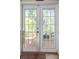 French doors leading to a covered outdoor area, with an area rug and decorative floor at 912 E 23Rd Ave, Tampa, FL 33605