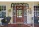 Cozy front porch showcasing a decorative front door, security gate, and inviting entrance at 912 E 23Rd Ave, Tampa, FL 33605