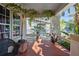 Charming front porch with plants, wood floors, and decorative features creating a welcoming entrance at 912 E 23Rd Ave, Tampa, FL 33605