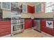 Close-up of the kitchen featuring stainless steel appliances and custom cabinetry at 912 E 23Rd Ave, Tampa, FL 33605