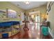 Living room featuring hardwood floors and an open view into the kitchen at 912 E 23Rd Ave, Tampa, FL 33605
