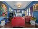 Inviting living room with a red leather couch, and colorful decor, creating a comfortable space at 912 E 23Rd Ave, Tampa, FL 33605