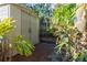 Back yard featuring a shed with brick pavers and lush greenery at 912 E 23Rd Ave, Tampa, FL 33605
