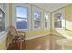 Bright sun room with hardwood floors and lots of windows for natural light at 912 E 23Rd Ave, Tampa, FL 33605