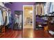 Spacious walk-in closet with custom shelving and storage solutions, leading to the bathroom at 912 E 23Rd Ave, Tampa, FL 33605