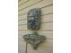 Unique outdoor wall fountain adds character and charm to the exterior of the home at 912 E 23Rd Ave, Tampa, FL 33605
