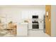 Well-equipped kitchen with white cabinetry, stainless steel appliances, and ample counter space at 9344 Bonita Mar Dr, Parrish, FL 34219
