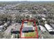 An aerial view shows property in a neighborhood with mature trees and green spaces, outlined in red to show property lines at 200 W Louisiana Ave, Tampa, FL 33603
