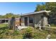 Exterior of the back of the house and backyard area surrounded by a fence at 200 W Louisiana Ave, Tampa, FL 33603