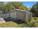 Exterior of the back of the house and backyard area with a wooden fence at 200 W Louisiana Ave, Tampa, FL 33603